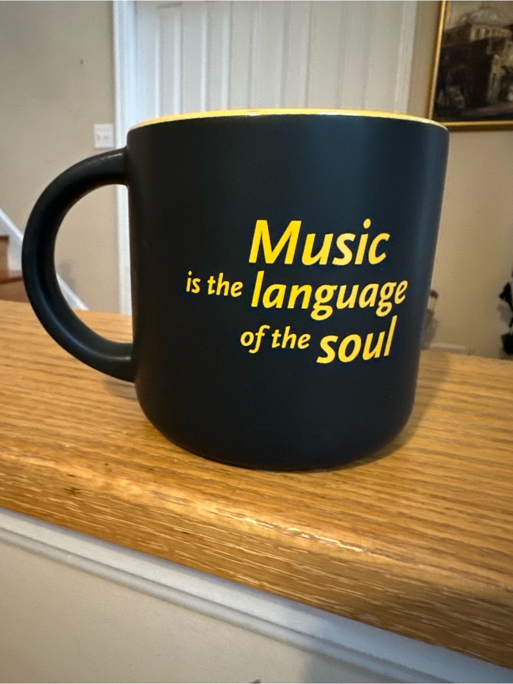 Black Matte Mug with Yellow 'Music is the Language of the Soul' Imprint.